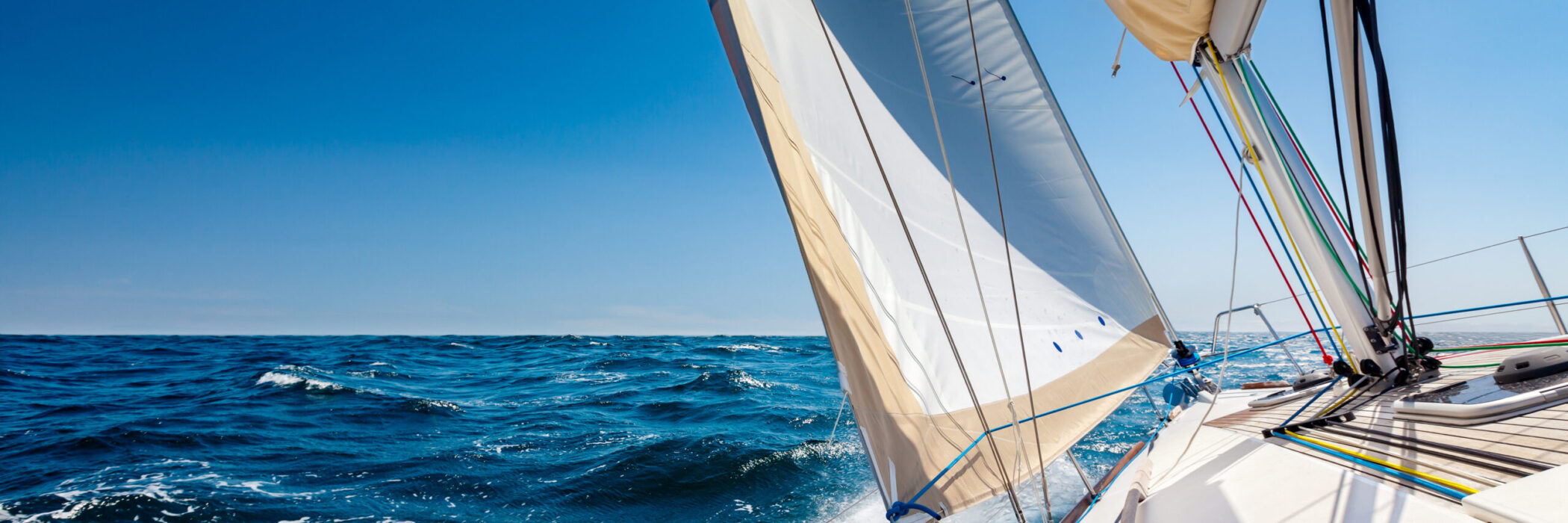 Sailing lboat at open sea in sunshine